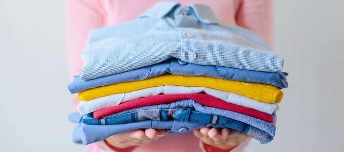 Girl Holding Pile Of Washed And Ironed Clothes Min Min Min